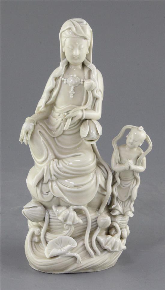 A Chinese Dehua blanc de chine group of Guanyin and an attendant, 24.5cm, slight restorations